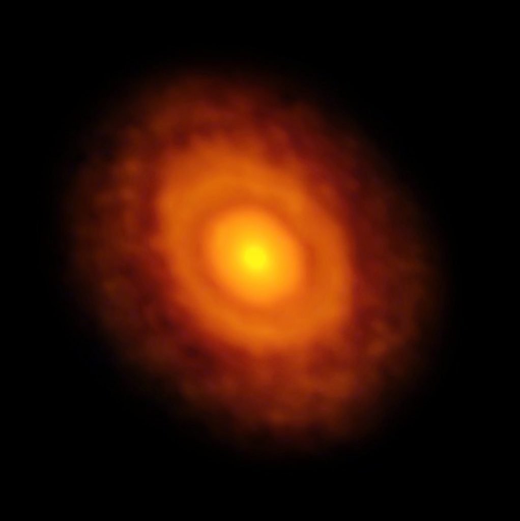 This image of the planet-forming disc around the young star V883 Orionis was obtained by ALMA in long-baseline mode. This star is currently in outburst, which has pushed the water snow line further from the star and allowed it to be detected for the first time. The dark ring midway through the disc is the water snowline, the point from the star where the temperature and pressure dip low enough for water ice to form.