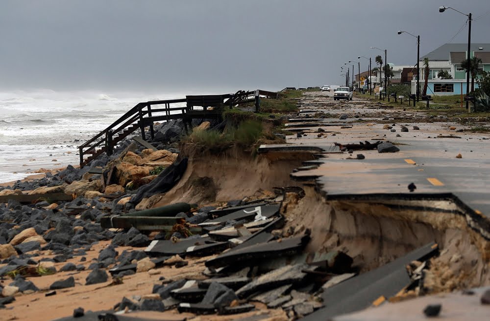 An official vehicle navigates debris as it passes along Highway A1A after it was partial washed away by Hurricane Matthew, Friday, Oct. 7, 2016, in Flagler Beach, Fla. Hurricane Matthew spared Florida’s most heavily populated stretch from a catastrophic blow Friday but threatened some of the South’s most historic and picturesque cities with ruinous flooding and wind damage as it pushed its way up the coastline.  (AP Photo/Eric Gay)